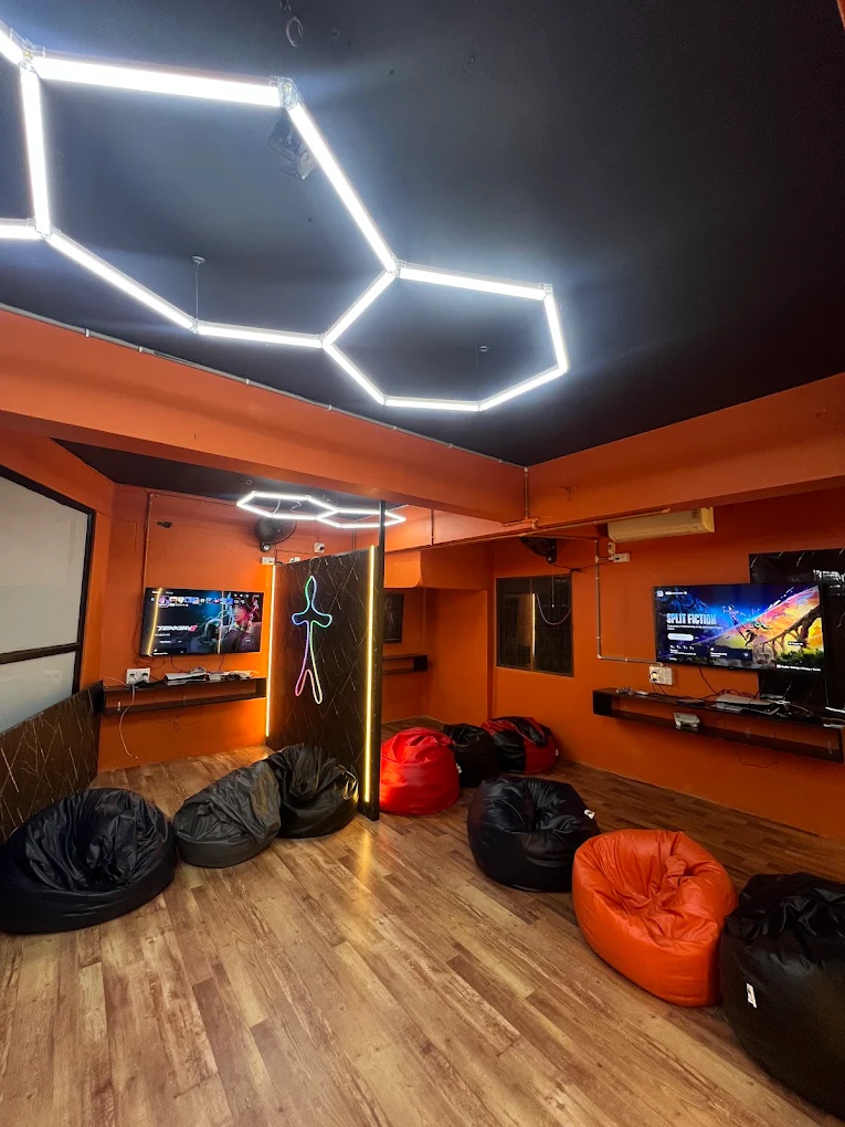 Shivam Playworld lounge with PS5 screens and bean bag seating